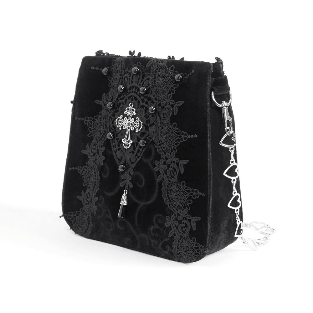 Elegant black velvet shoulder bag with gothic floral embroidery and silver cross applique. Perfect for edgy style lovers.