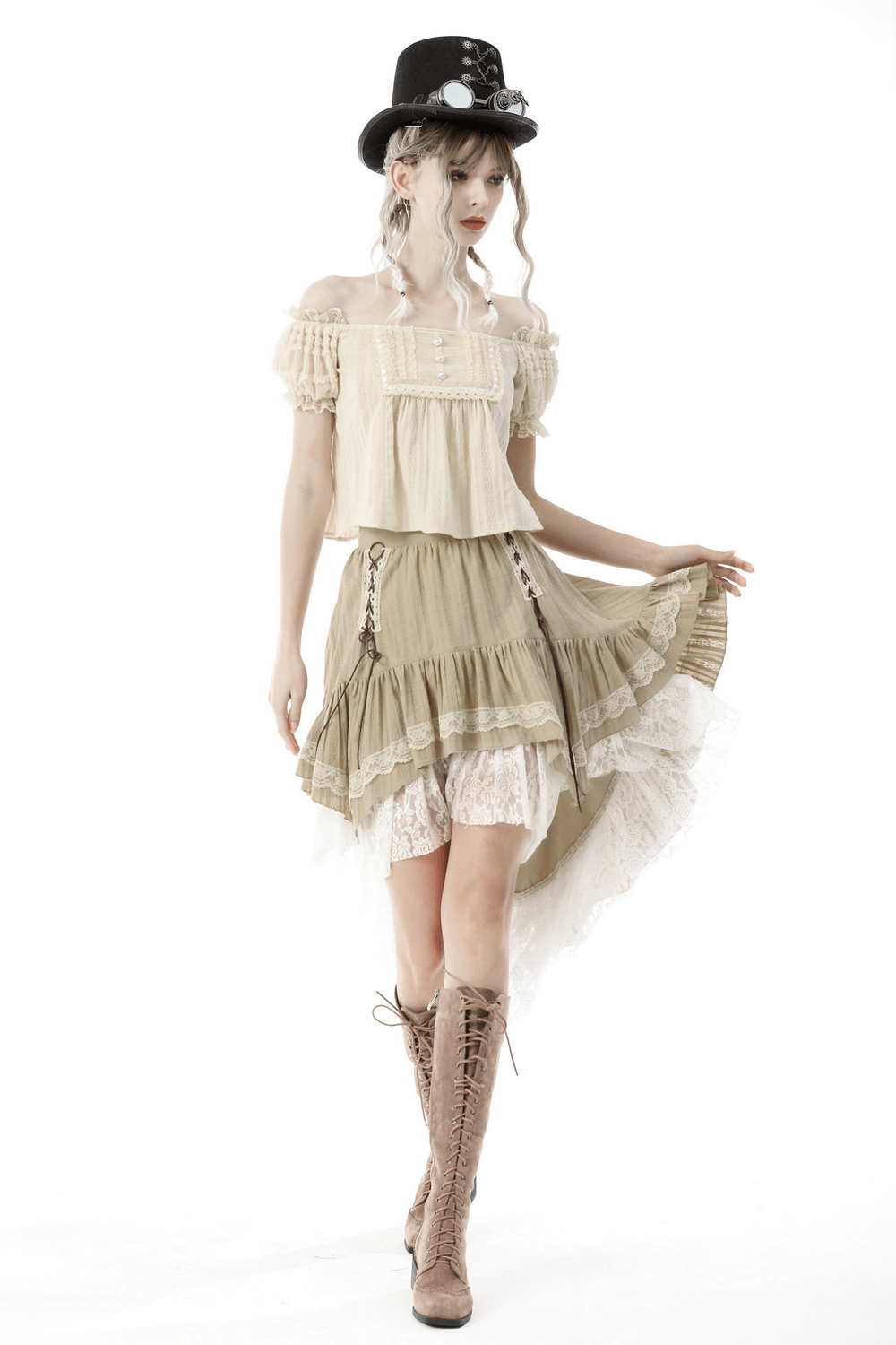 Chic model showcasing an elegant beige layered skirt with lace detail, paired with a stylish off-shoulder top and a fashionable hat.