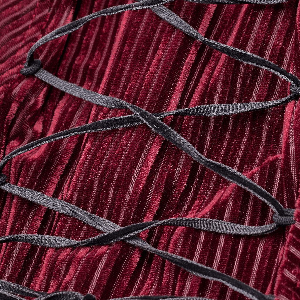 Close-up of burgundy velvet fabric featuring black lace detailing for gothic corset shirt.