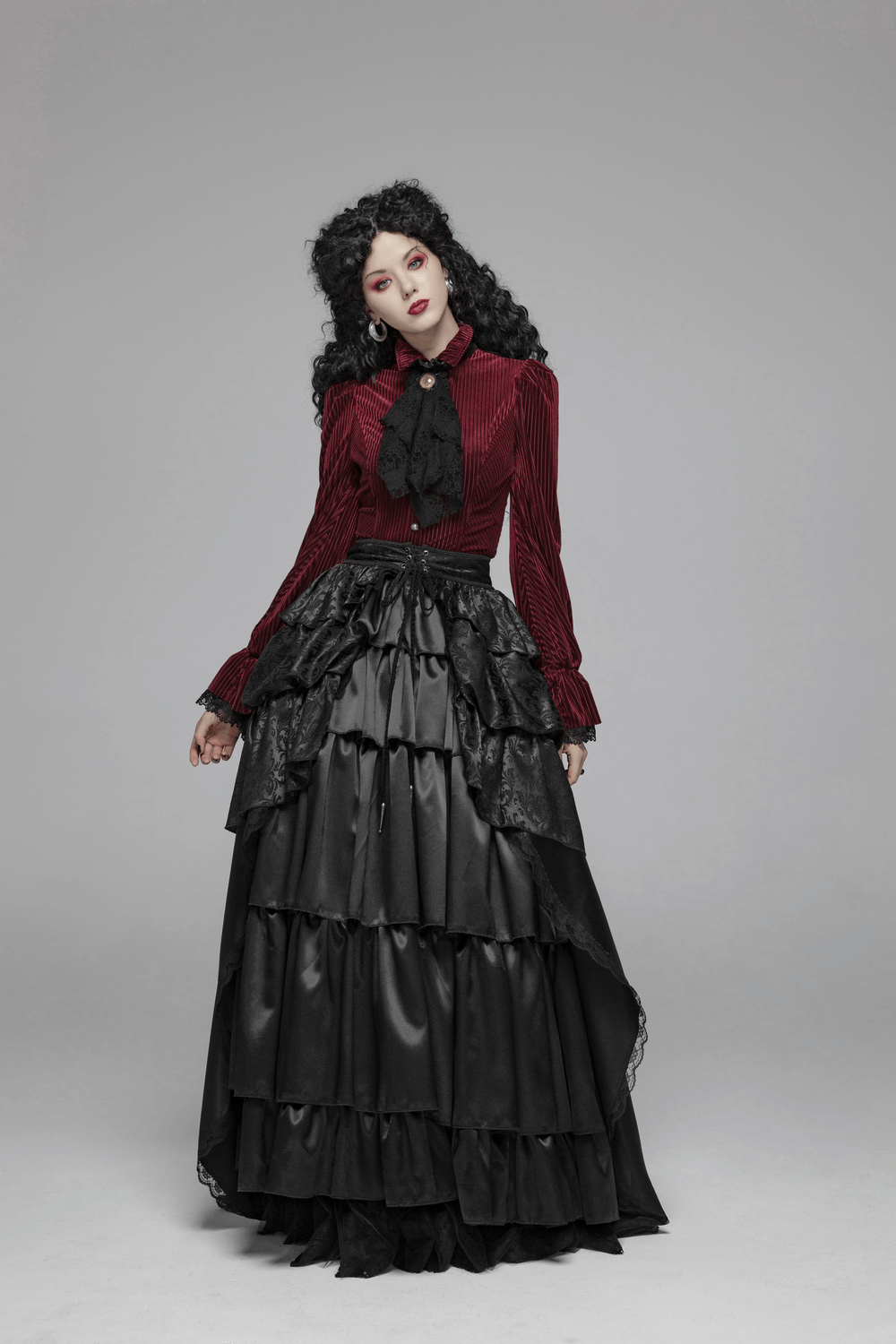 Elegant Victorian gothic outfit featuring burgundy velvet corset shirt and black layered skirt.