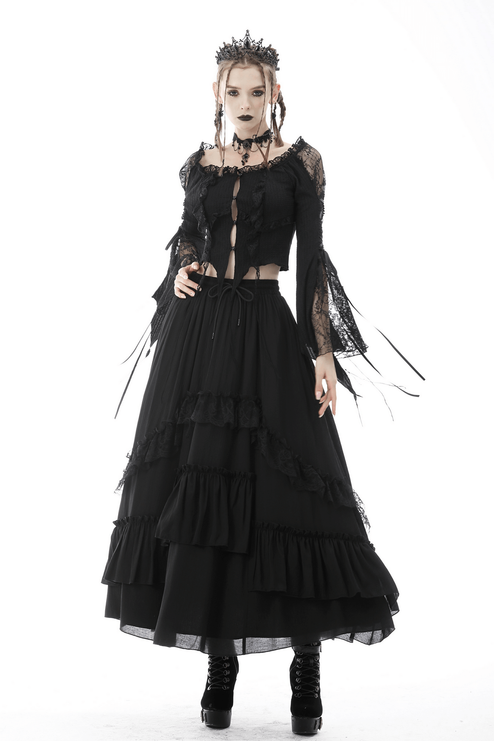 Elegant black tiered maxi skirt with lace detail, paired with a gothic style top for a dramatic dark romance look.