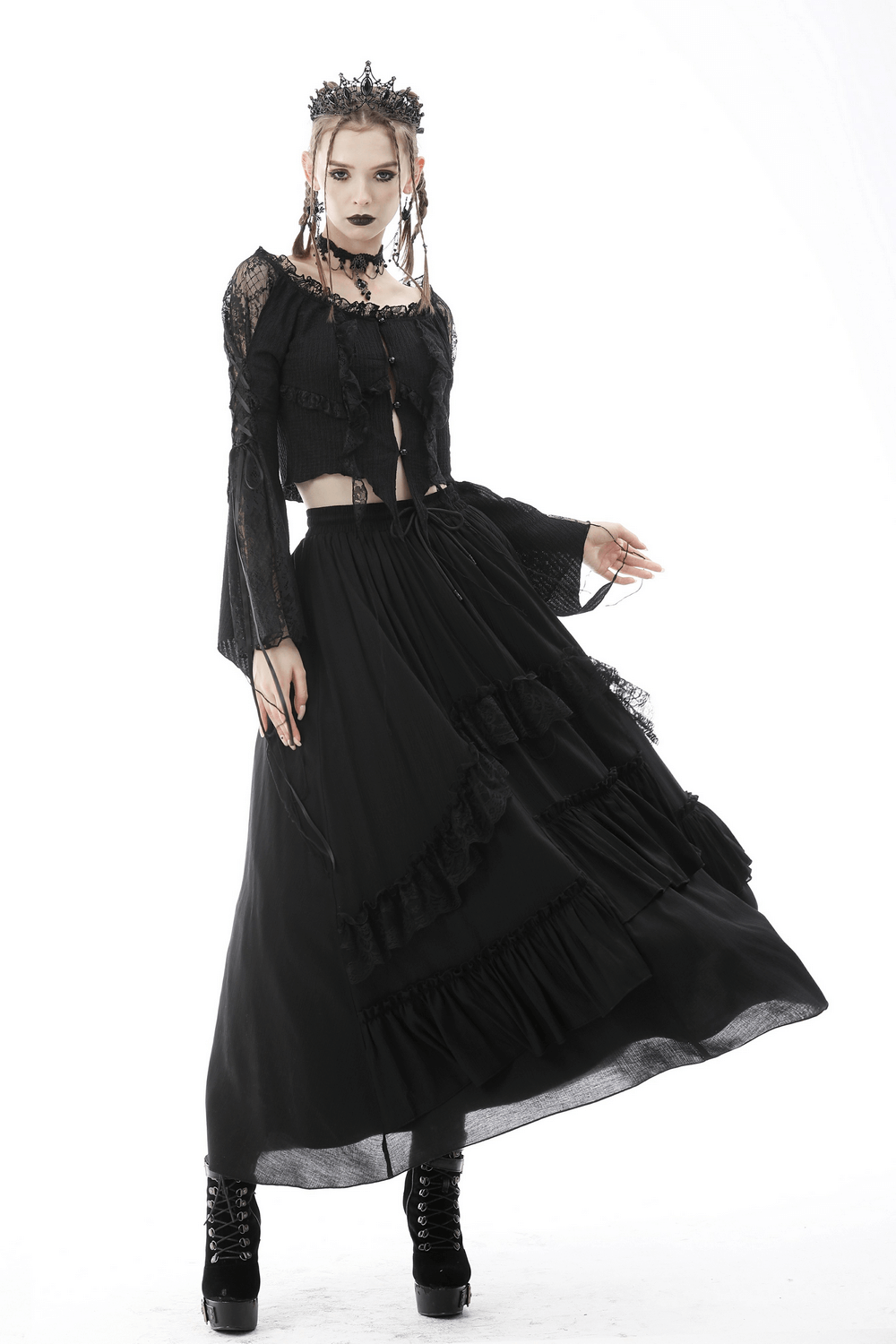 Elegant model in a black lace ruffle skirt and matching top, exuding dark romance and steampunk flair.
