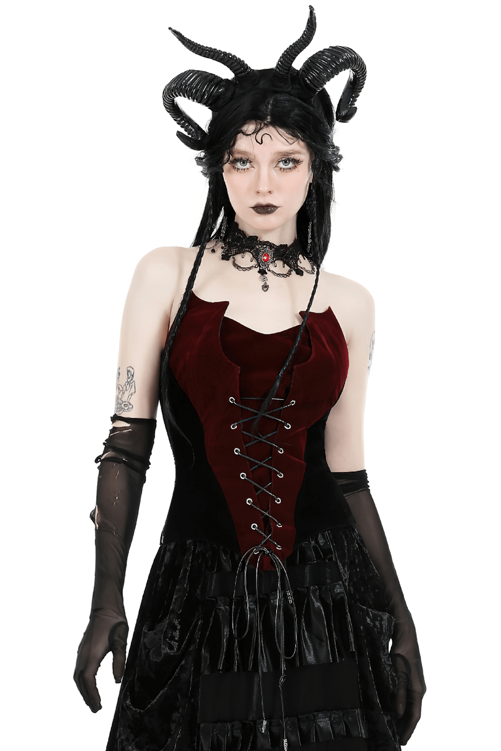 Dramatic wine-red velvet corset with lace-up front, paired with edgy accessories and sleek gloves.