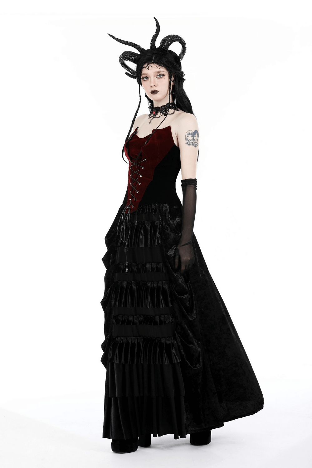 Elegant women's wine-red velvet bustier corset with dramatic lace-up front and flowing black skirt.