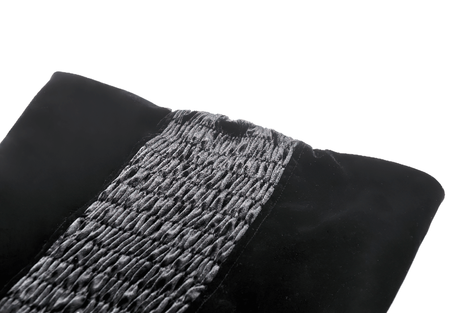 Close-up of black velvet corset with intricate lace-up detail, showcasing textured fabric and elegant design.