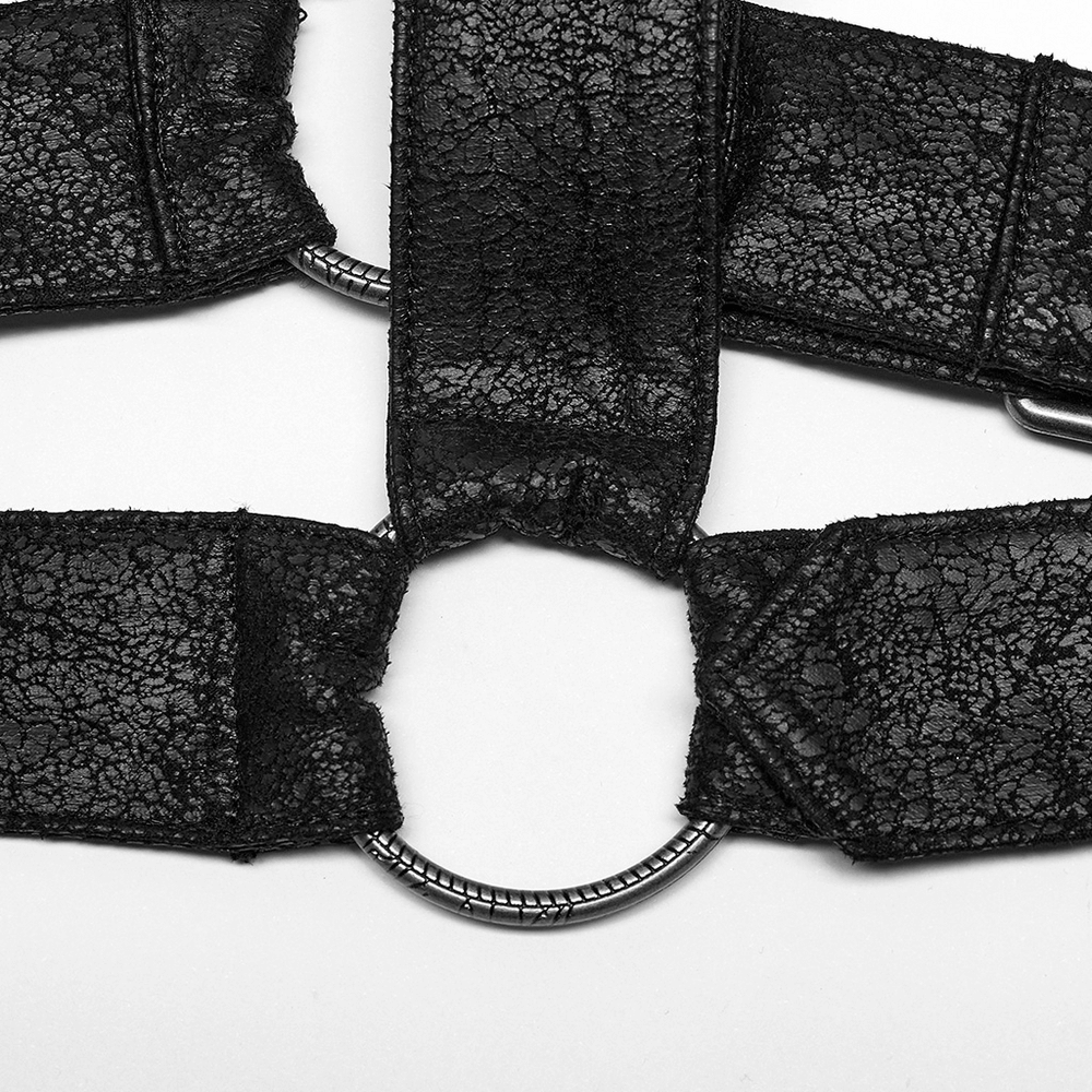 Close-up of the adjustable ring and textured black leather straps of the Gothic shoulder guard for men.