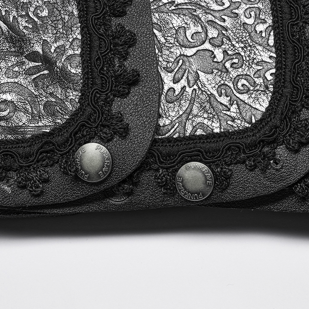 Close-up of embossed leather with intricate gothic patterns and decorative buttons for a unique shoulder guard design.