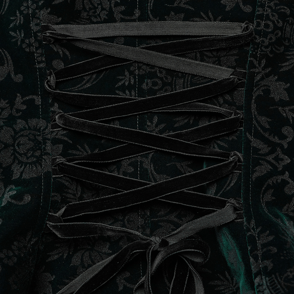 Close-up of embossed velvet goth jacket detailing with lace-up design and floral texture.