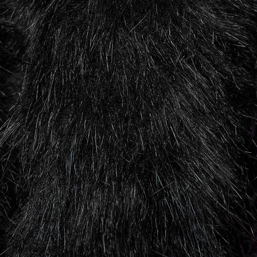 Close-up of plush black fur detailing, showcasing the luxurious texture of the gothic jacket.