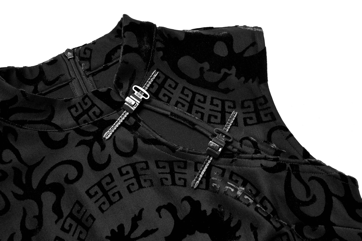 Close-up of the embroidered dragon A-line dress featuring a stylish plastic buckle and intricate velvet detailing.