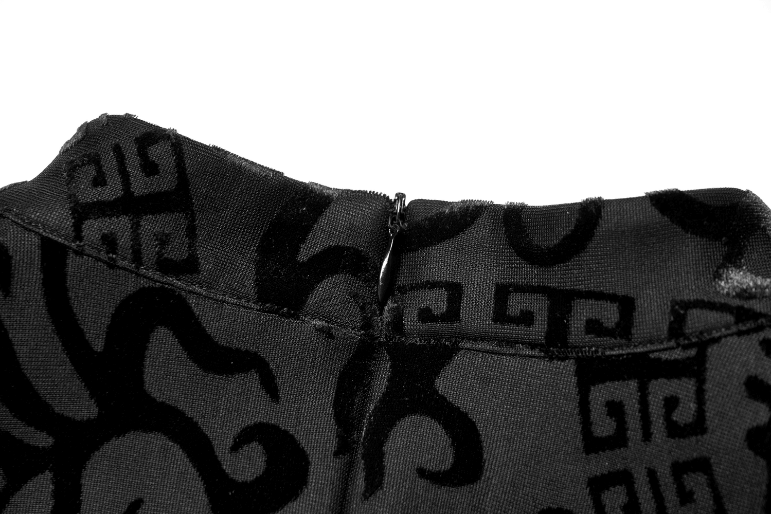 Detail view of the back neckline and zipper of the embroidered dragon A-line dress in plush velvet.