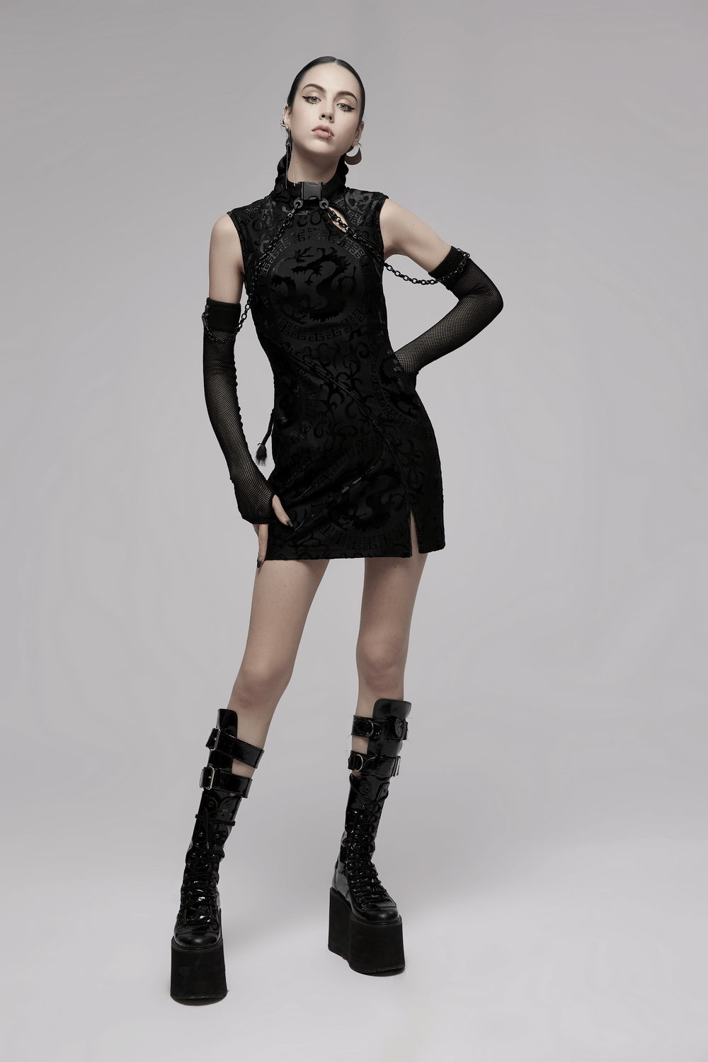 Embroidered dragon A-line dress in stretch velvet with edgy accents and trendy accessories.