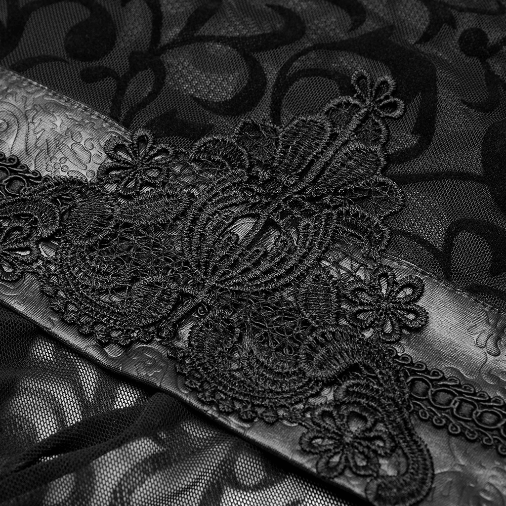 Close-up of luxurious black embroidered lace detail on gothic kimono dress highlighting intricate design.