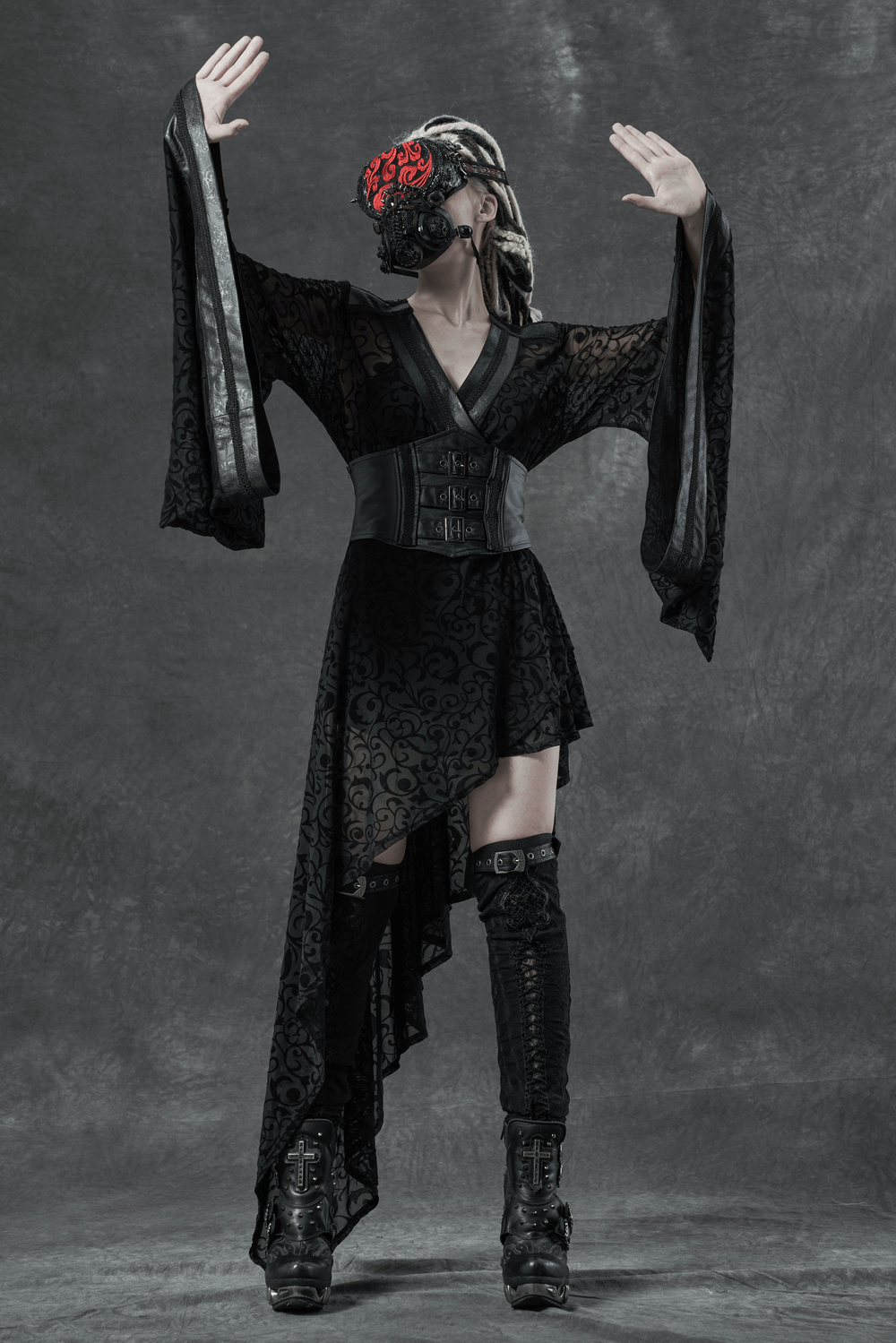 Gothic asymmetrical kimono dress with embroidered accents and detachable belt, styled with bold accessories.