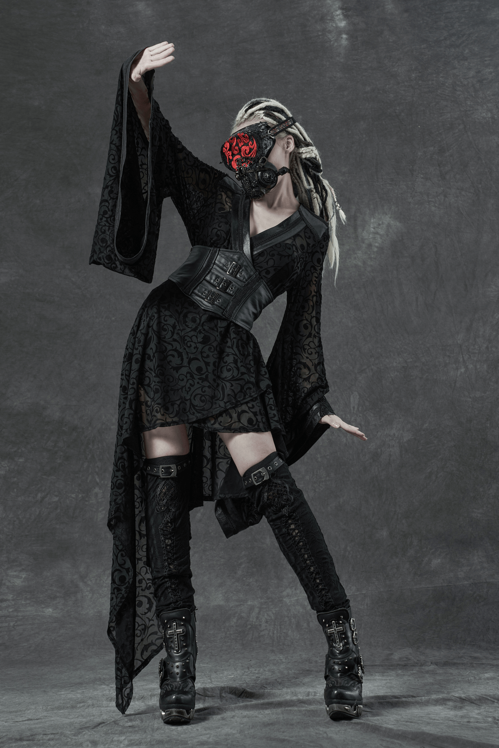 Gothic asymmetrical kimono dress with embroidered accents and detachable belt, styled with edgy accessories.