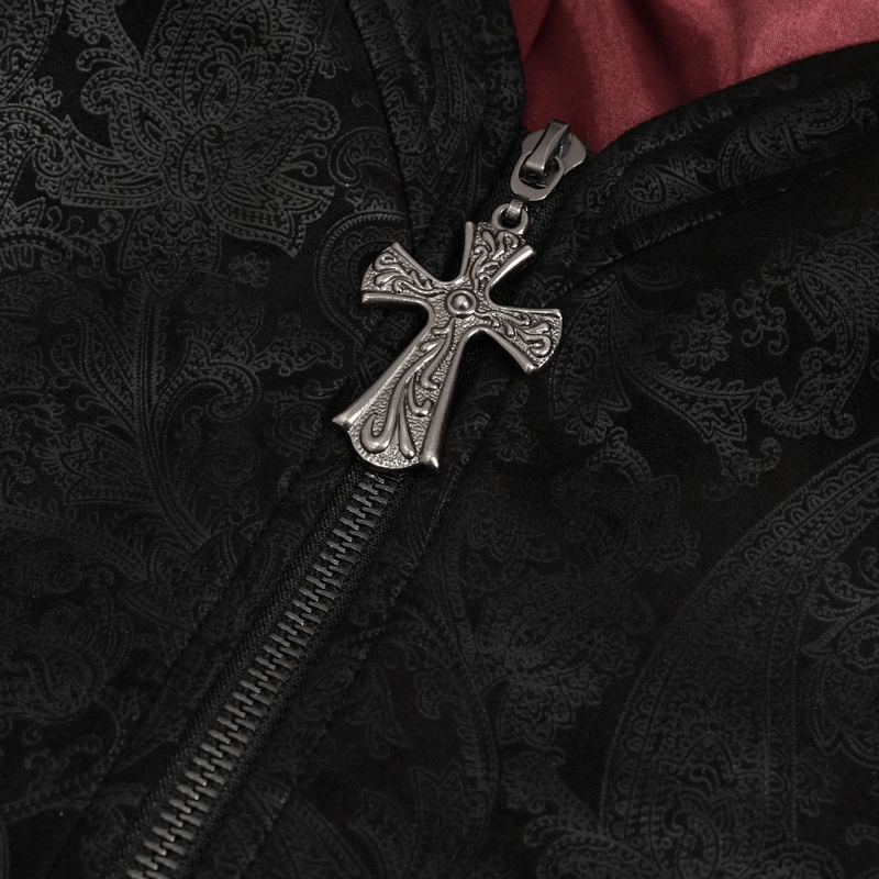 Close-up of gothic zipper detail featuring a cross on an embroidered black top, embodying edgy elegance.
