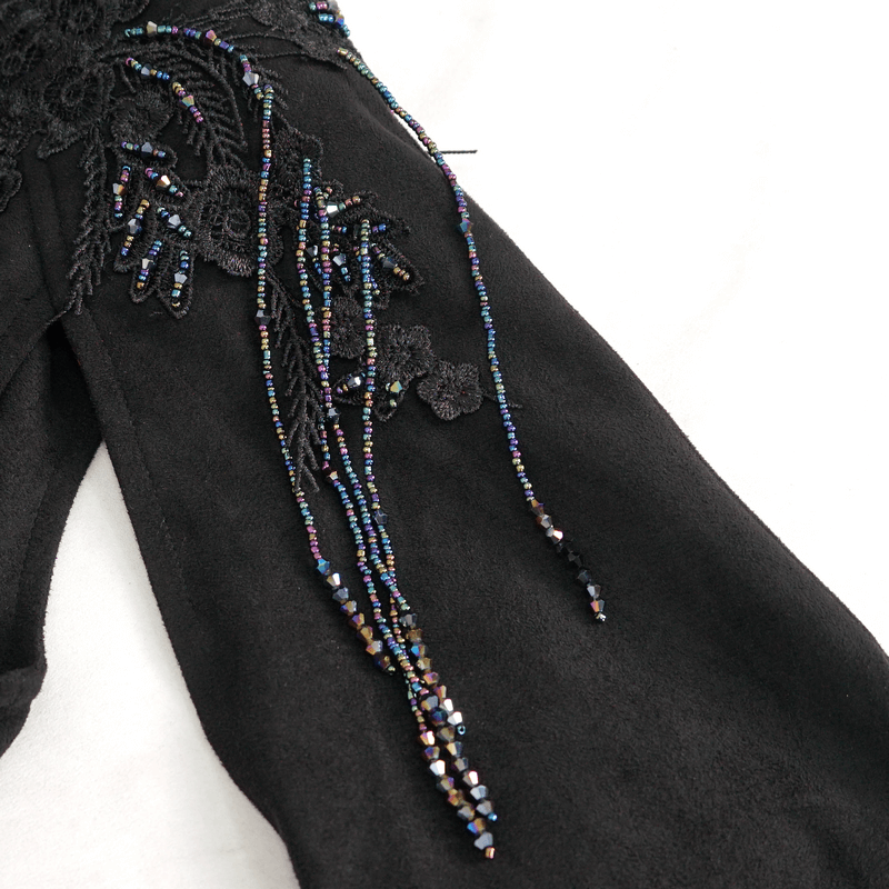 Close-up of intricate embroidery and beaded details on gothic women's top, showcasing elegant craftsmanship.