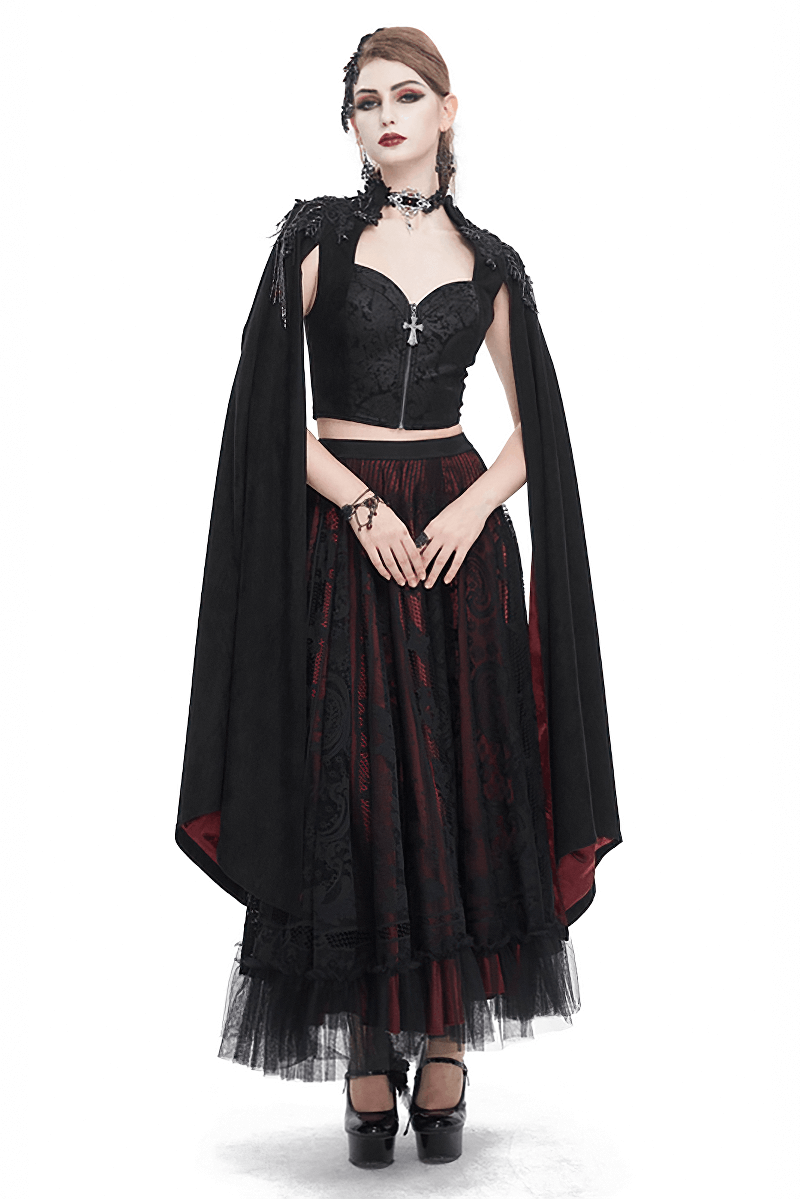 Gothic elegance featuring a model in a black and red ensemble with a cape, corset top, and gothic accessories.