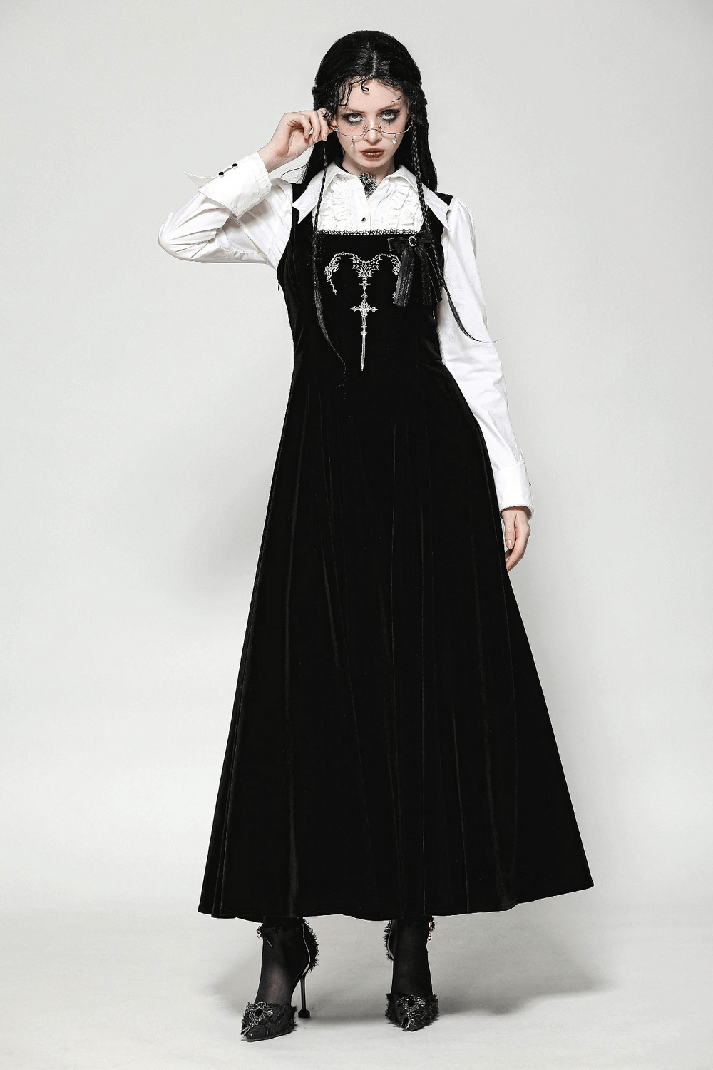 Enchanting Gothic black long dress with lace-up back, perfect for stylish events, featuring velvet fabric and silver accents.