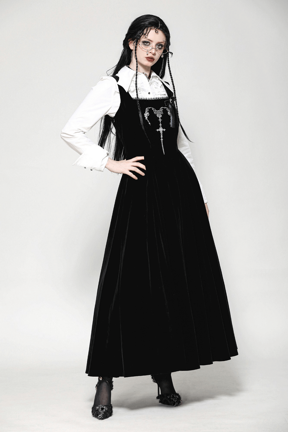 Stylish black gothic dress with lace-up back and velvet fabric, perfect for striking appearances at any event.