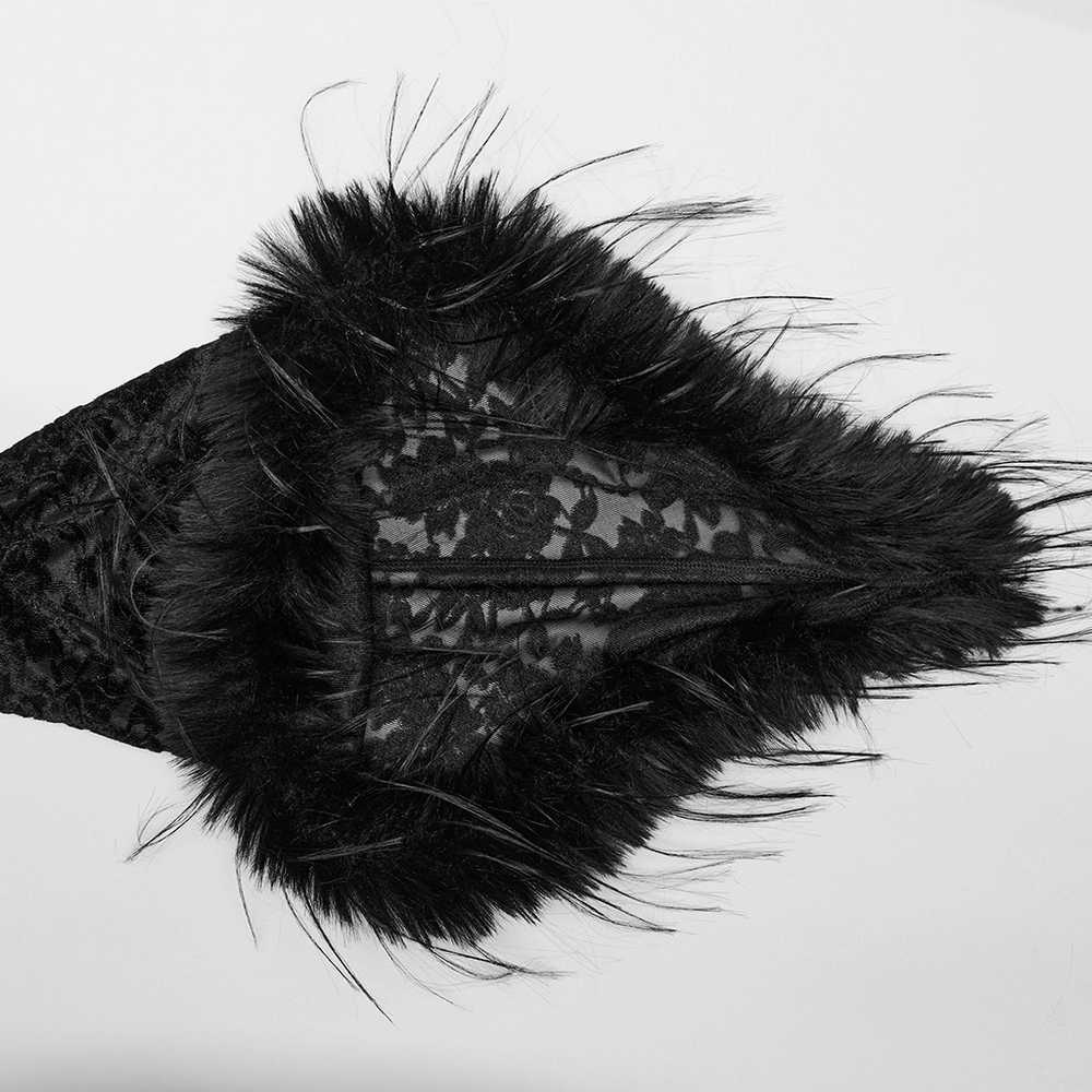 Detail view of the enchanting gothic dress featuring elegant black lace and luxurious fur trim.