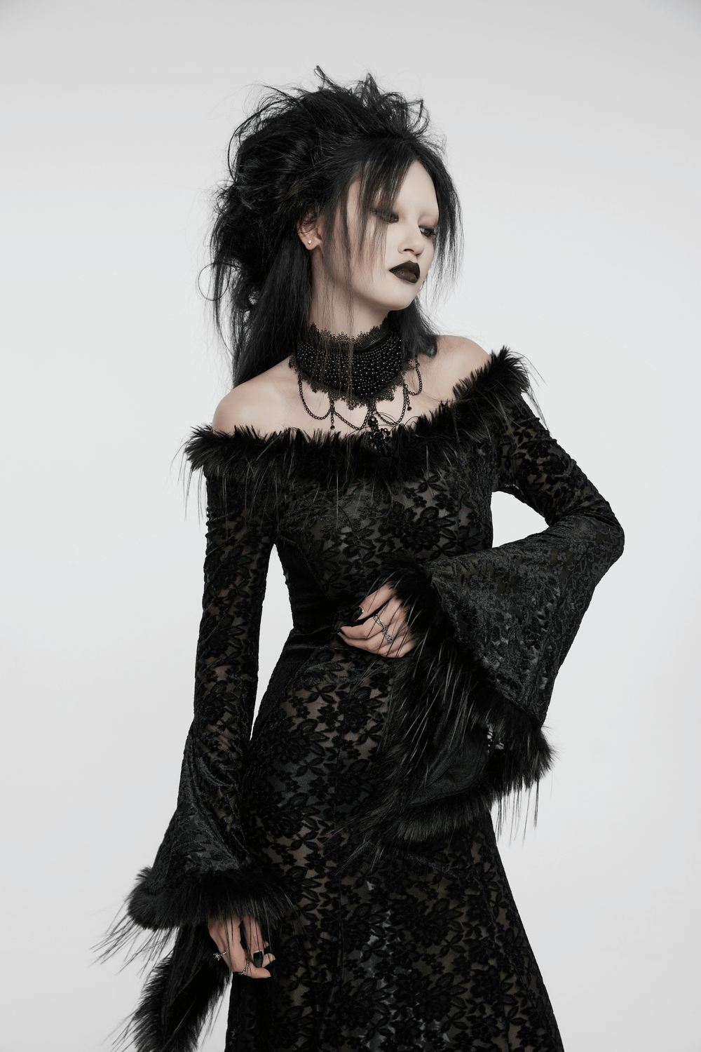 Enchanting gothic dress with fur-trimmed bell sleeves and lace accents for dark romance.
