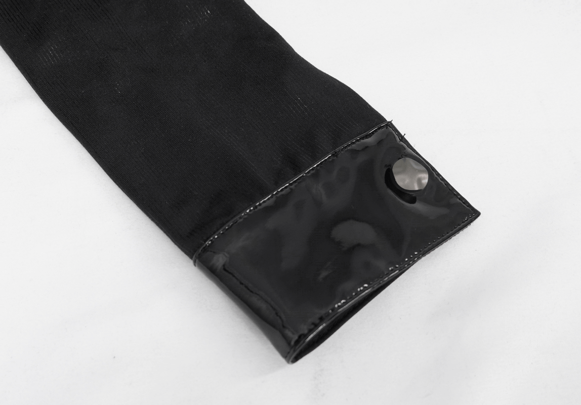 Close-up of black gothic crop top sleeve with shiny patent cuff detail and snap button.