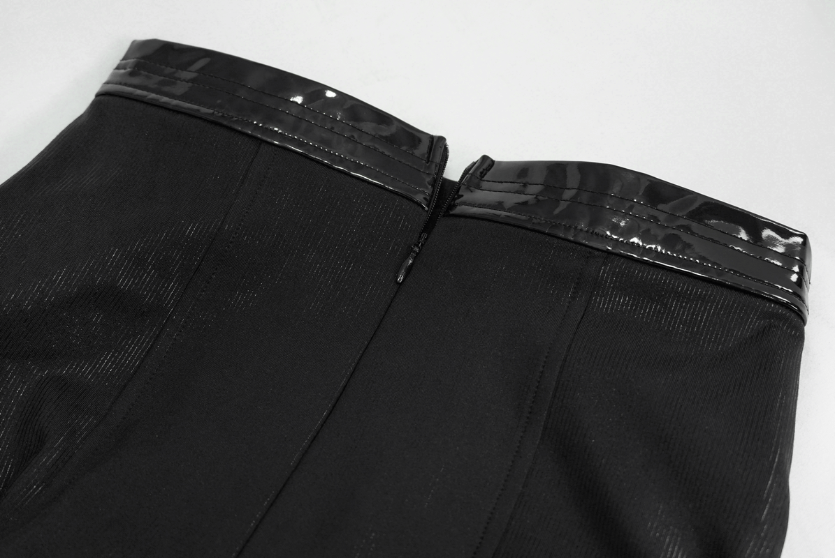 Close-up of a black crop top with glossy patent trim at the neckline, showcasing gothic fashion style details.