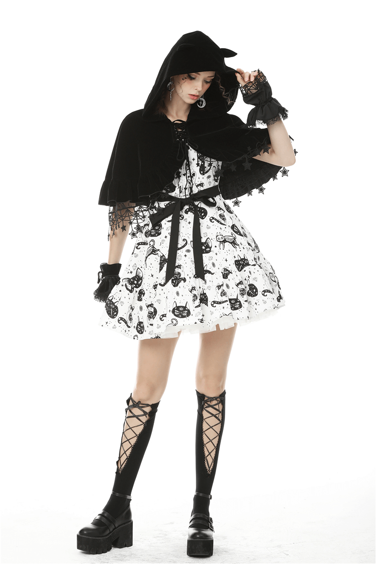 Gothic velvet cat ear cape with star tassels, paired with a playful black and white dress for a magical look.