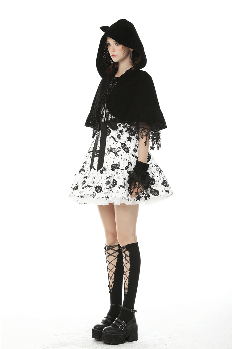 Model wearing black velvet cat ear cape with lace details and spooky floral skirt, showcasing gothic style.