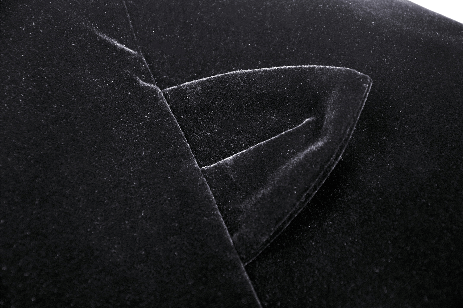 Close-up of the luxurious black velvet fabric and cat ear detail on a stunning cape.
