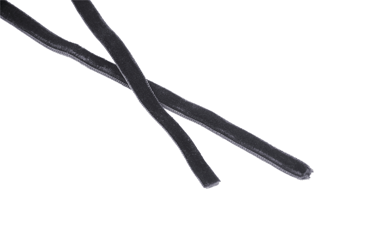 Close-up of two black velvet ribbons perfect for crafting, fashion, or costume design.