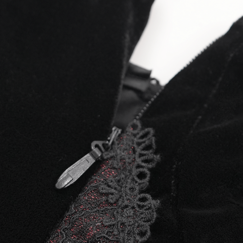 Close-up of beaded lace appliques and zipper on black velvet maxi dress, showcasing gothic floral details.