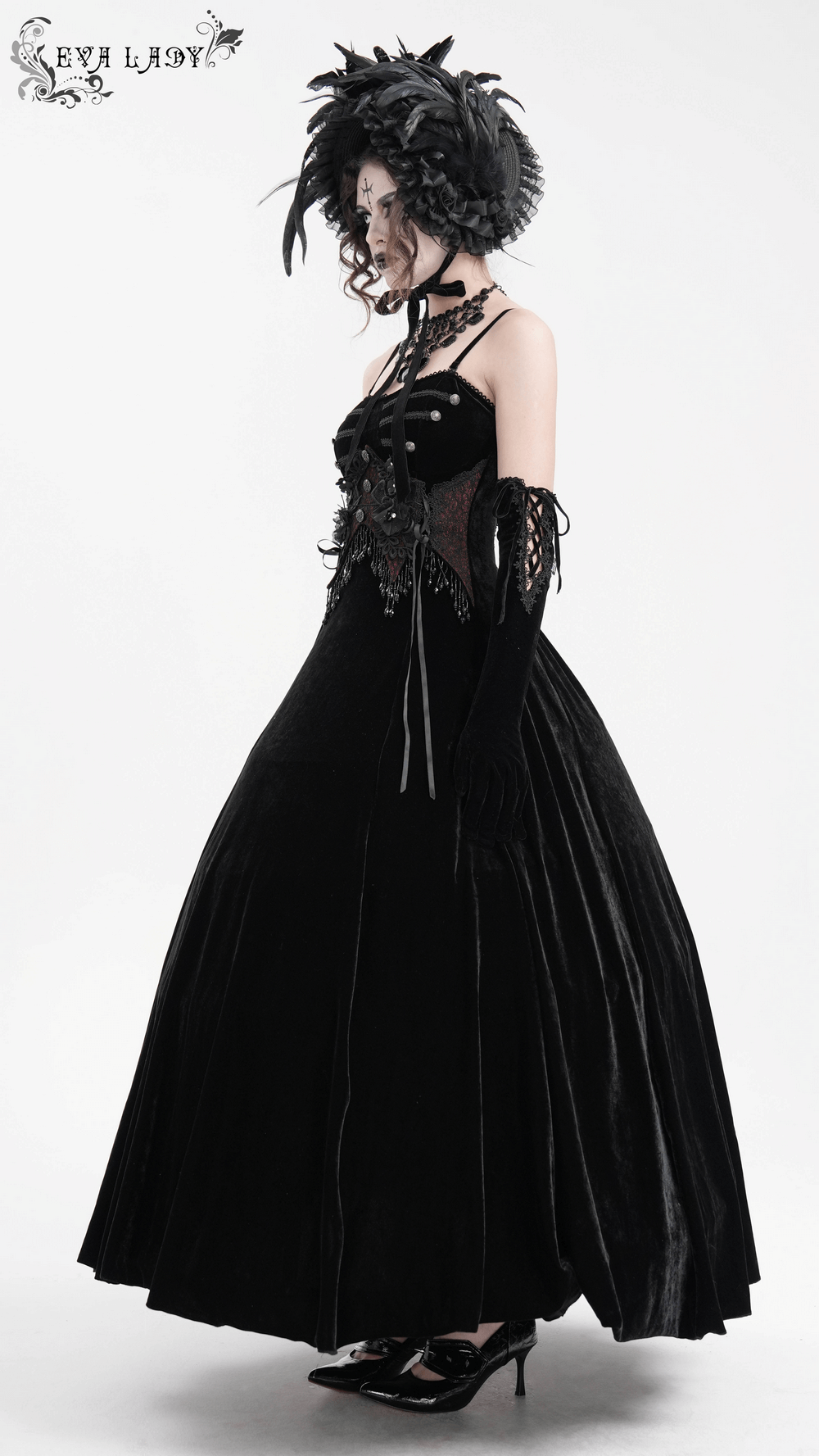 Enchanting black velvet maxi dress with beaded lace appliques and gothic floral accents, perfect for alternative fashion.
