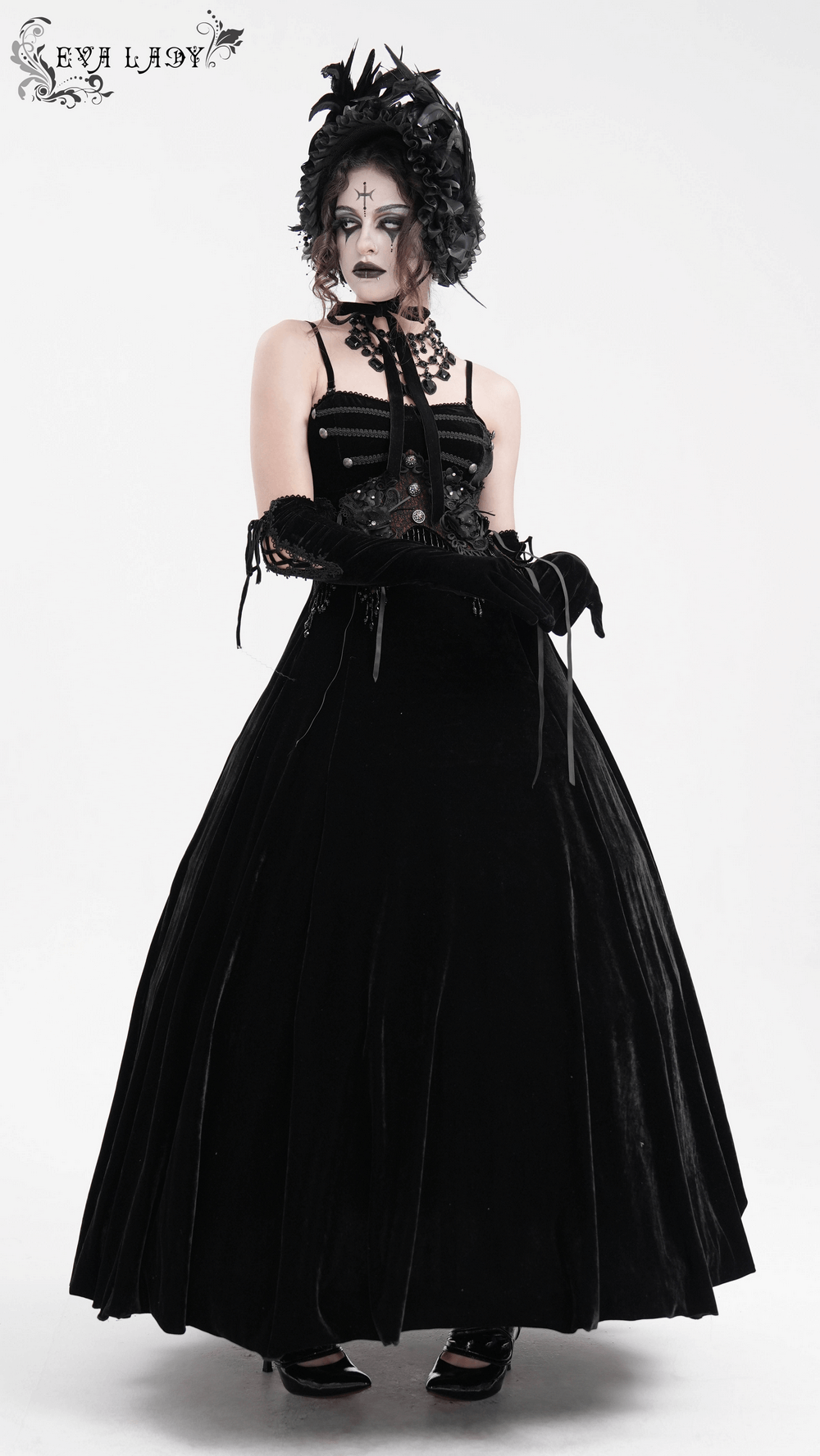 Enchanting black velvet maxi dress with gothic beaded lace appliques and flowing A-line skirt.