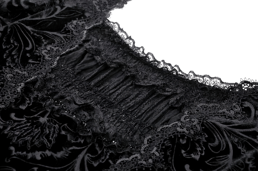 Close-up of intricate black lace trim on a gothic lace dress, showcasing vintage elegance and dark allure.