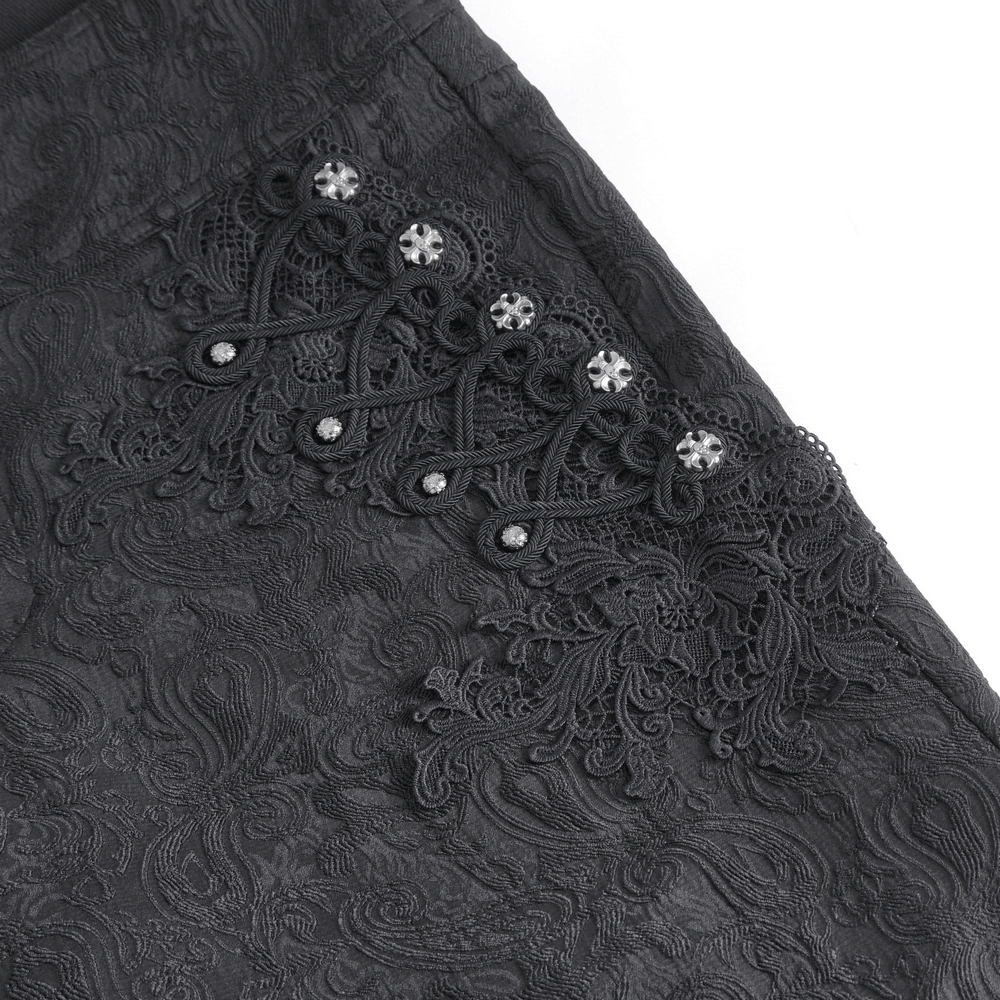 Close-up of exquisite black floral embroidered trousers with intricate lace detailing and sparkling sequins.
