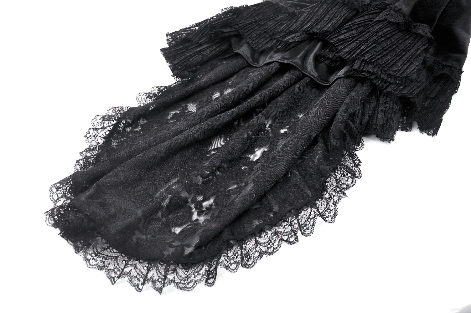 Elegant black velvet fabric showcasing intricate lace overlay and ruffles for a gothic-inspired fashion statement.