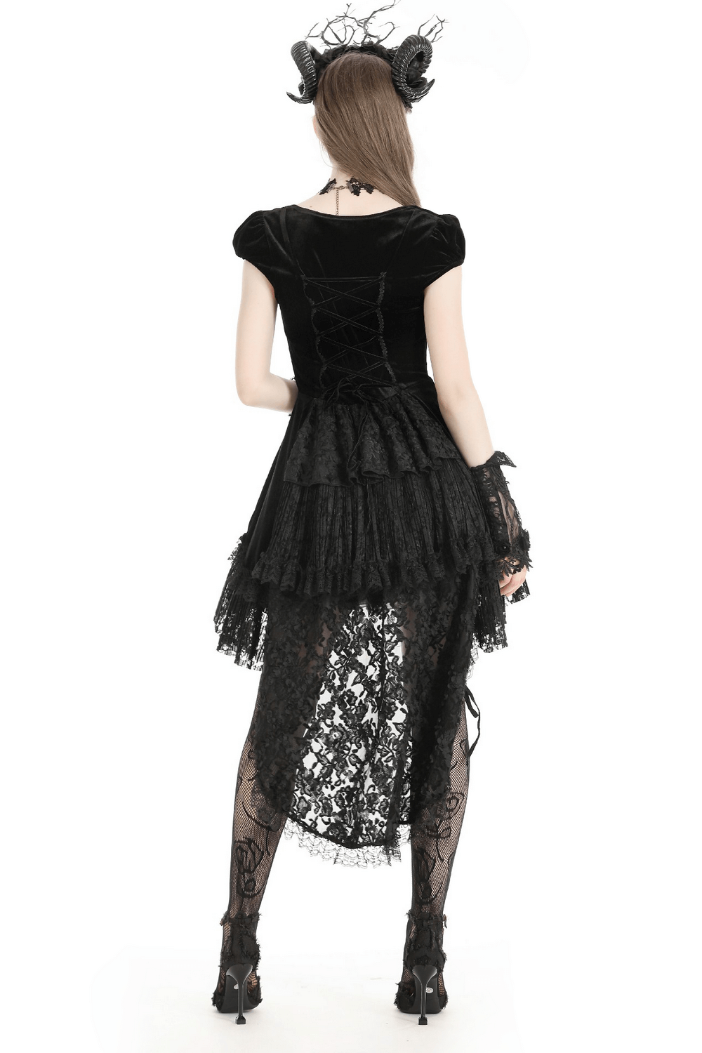 Back view of elegant gothic swallowtail dress with lace overlay and ruffles, showcasing dramatic hem and lace-up detailing.