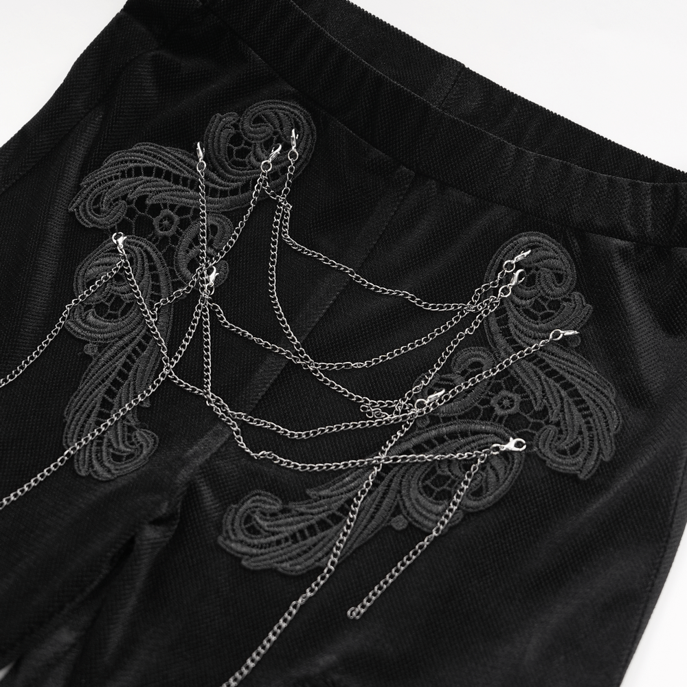 Elegant black lace palazzo pants featuring intricate chain detailing for a gothic chic look.