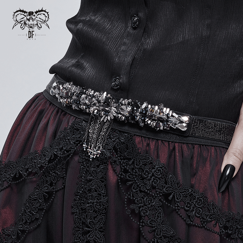 Elegant black crystal glass tassel belt accentuating a punk outfit, featuring intricate detailing and a stylish buckle.
