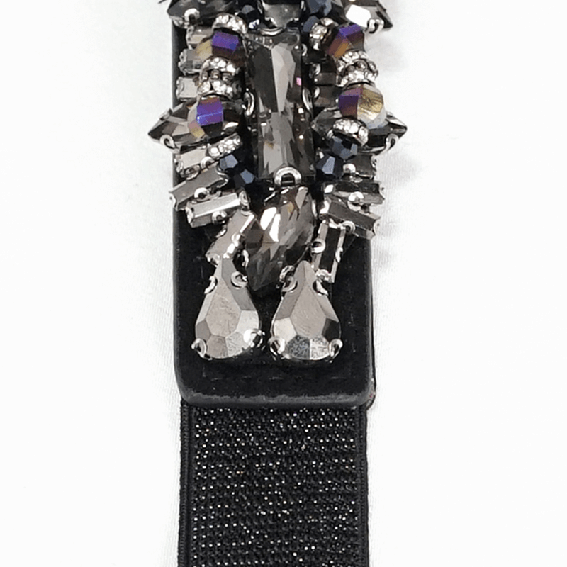 Close-up of a stylish black belt with sparkling crystal embellishments, perfect for gothic punk outfits.