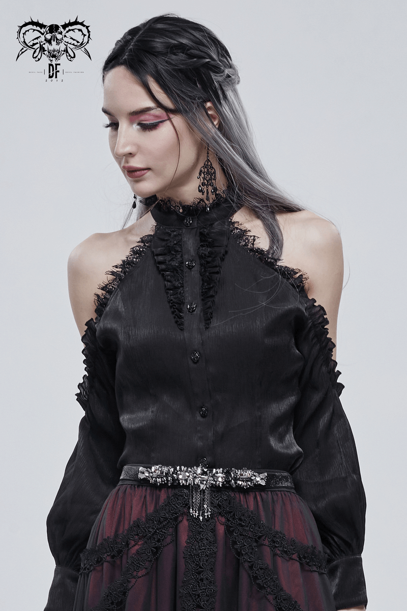 Gothic punk style woman in a black ruffled blouse showcasing a crystal tassel belt for a trendy, edgy look.