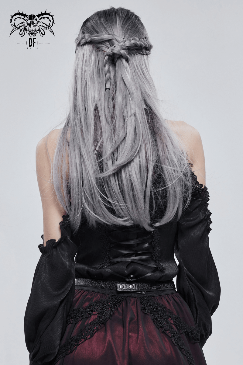 Woman with long silver hair in gothic outfit, showcasing a stylish black top and skirt, perfect for punk fashion.