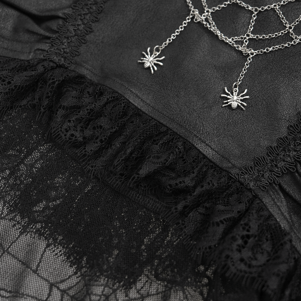 close-up of black spider web gothic skirt with lace detailing and silver spider necklace. Perfect for dark elegance.