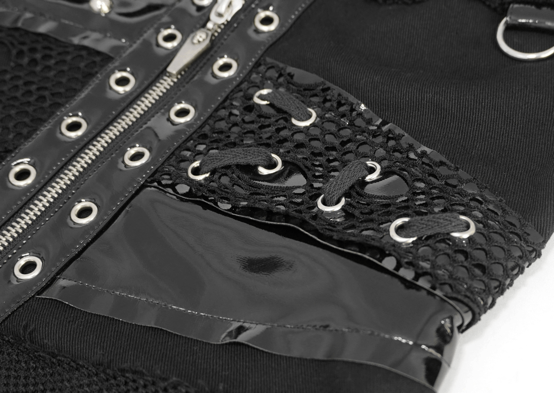 Close-up of black punk style waistcoat detailing, featuring zippers, rivets, and netted fabric for a gothic fashion look.