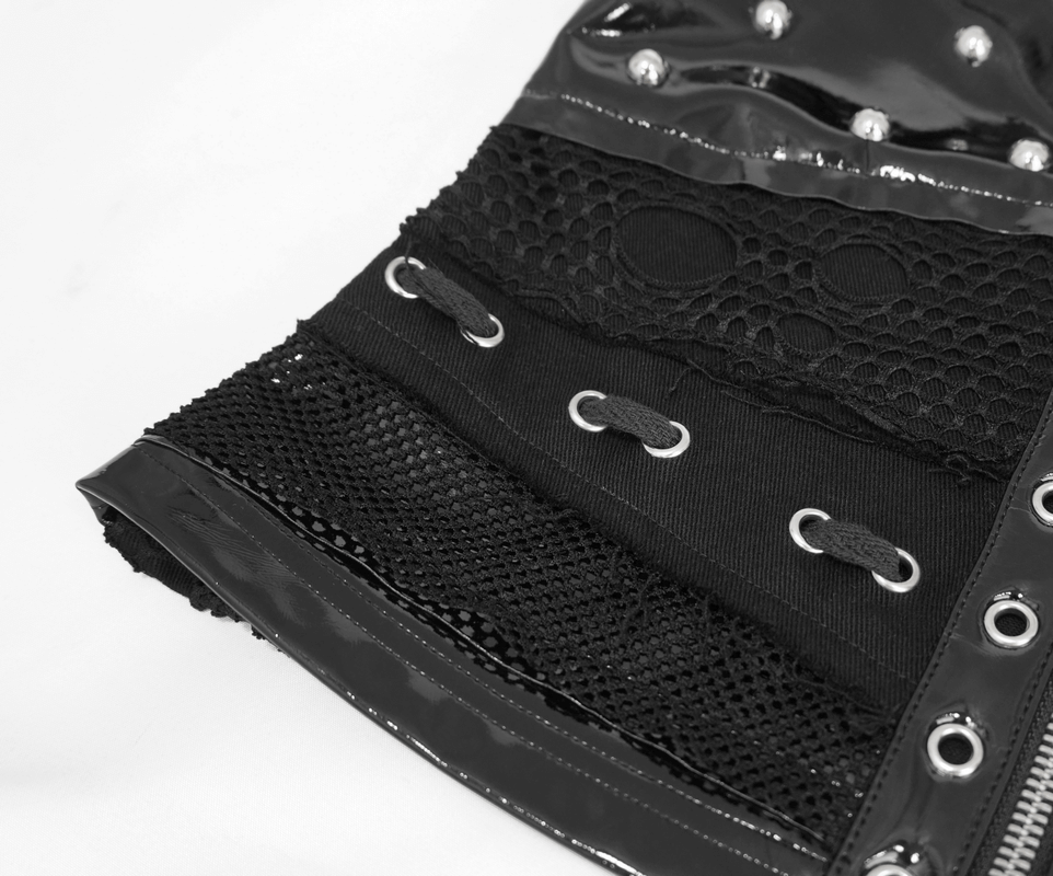 Close-up of a women's black punk style waistcoat featuring rivets and mesh fabric for a gothic fashion look.