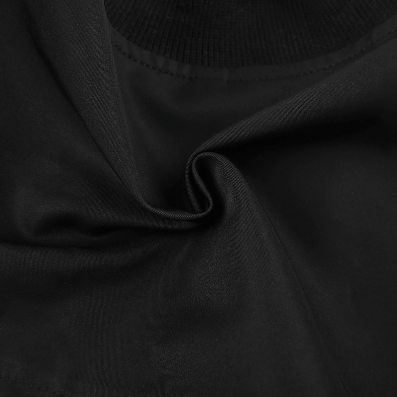Close-up of soft black fabric showcasing the texture of a women's punk style zipper cropped top.