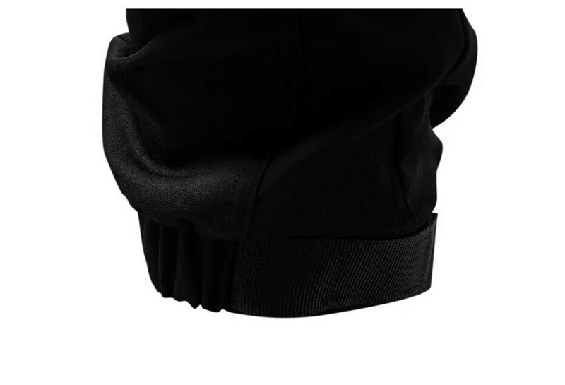 Close-up of the elastic waistband of men's fashion cargo pants in black, showcasing comfort and flexibility.