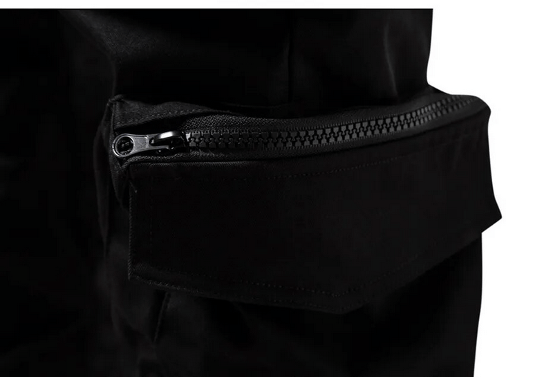 Close-up of stylish black cargo pants pocket with zipper, showcasing functionality and modern design.
